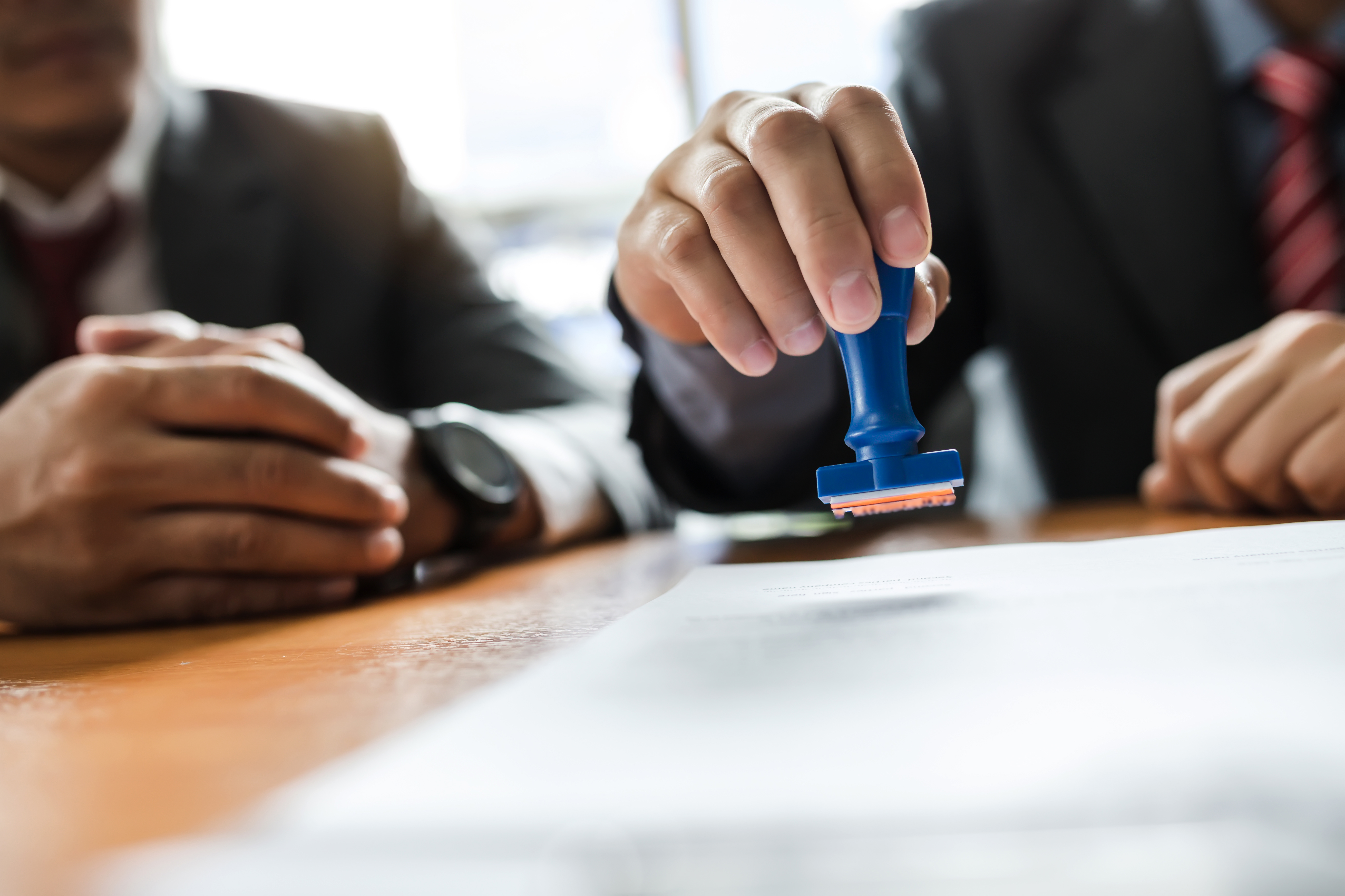A specialist preparing a trademark application with a client